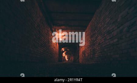 concrete underground tunnel with brick walls Stock Photo