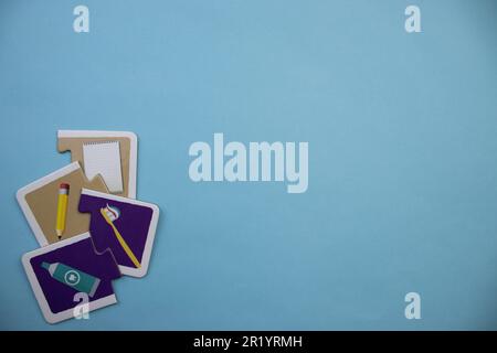 Information puzzle placed on the edge of the blue background. Personal care, office supplies Stock Photo