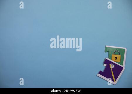 Information puzzle placed on the edge of the blue background. lock, toothbrush Stock Photo