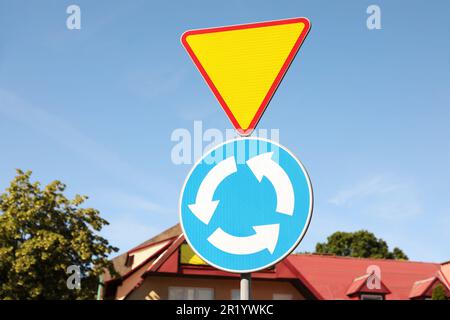 Different road signs on city street. Traffic rules Stock Photo