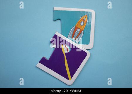 Information puzzle placed on a blue background. Space shuttle, toothbrush Stock Photo