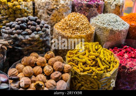 Variety of spices and herbs on the arab street market stall. Dubai Spice Souk, United Arab Emirates Stock Photo