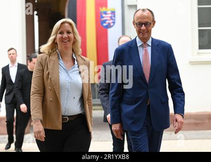 Wiesbaden, Germany. 16th May, 2023. Friedrich Merz, federal chairman of the CDU, and Ines Claus, parliamentary party leader of the CDU in the Hessian state parliament, are in the courtyard of the state parliament on their way to a press statement. Credit: Arne Dedert/dpa/Alamy Live News Stock Photo