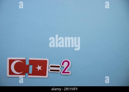 Mathematical operation with educational puzzles placed on the edge of the blue background. collection, two Stock Photo