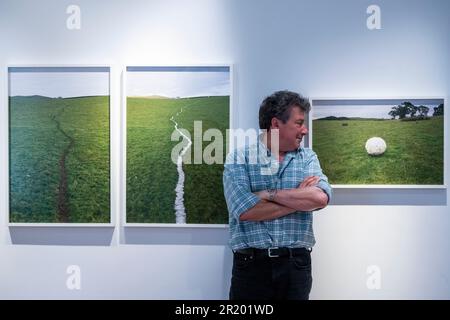 London, UK.  16 May 2023.  Photographer Alexander Lindsay with 'Wool Sheep Track', 2018, and 'Wool Wrapped Around a Thistle', 2019, both by Andy Goldsworthy at the first ‘Space to Breathe’ exhibition.  Works by four British artists are on show at Cromwell Place in South Kensington ahead of the main exhibition and festival, at Bowhouse, in the East Neuk of Fife, Scotland 15 July to 6 August 2023.    Credit: Stephen Chung / Alamy Live News Stock Photo