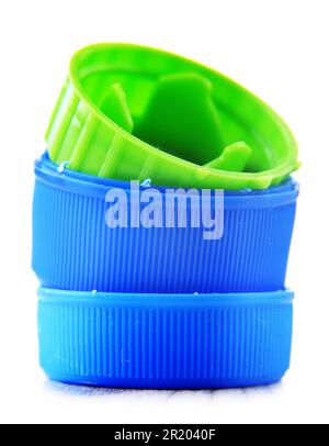 Colorful plastic bottle caps isolated on white. Recycling Stock Photo