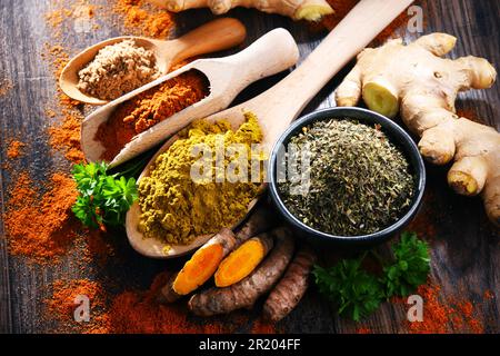 Composition with spices on wooden kitchen table Stock Photo