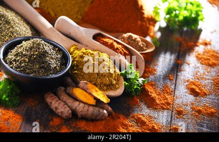 Composition with spices on wooden kitchen table Stock Photo
