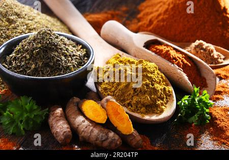 Composition with spices on wooden kitchen table Stock Photo