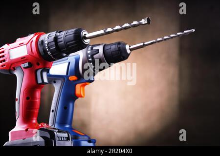 Composition with two cordless drills also working as screw guns Stock Photo