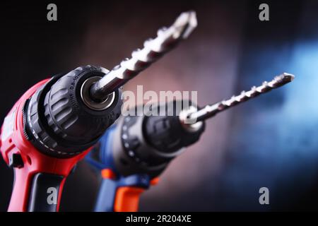 Composition with two cordless drills also working as screw guns Stock Photo