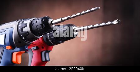 Composition with two cordless drills also working as screw guns Stock Photo