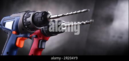 Composition with two cordless drills also working as screw guns Stock Photo