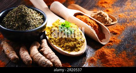 Composition with spices on wooden kitchen table Stock Photo