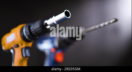 A screw gun and a pistol-grip cordless drill Stock Photo