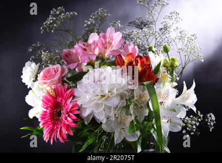 Composition with bouquet of freshly cut flowers Stock Photo