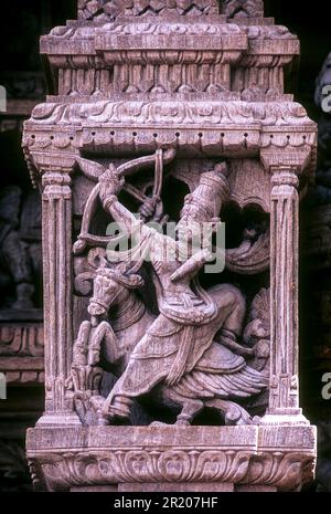 Revanta as a huntsman on a horse, with a bow and arrow, 17th century wooden carvings in Meenakshi-Sundareswarar temple Chariot at Madurai, Tamil Stock Photo