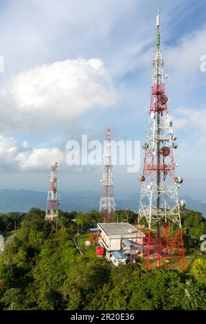 telecommunication towers with antennas with beautiful blue sky background on mount gunung raya, the highest peaks in Langkawi, Malaysia. Stock Photo