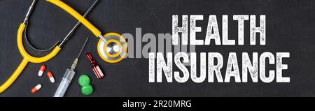 Stethoscope and pharmaceuticals on a blackboard - Health insurance Stock Photo