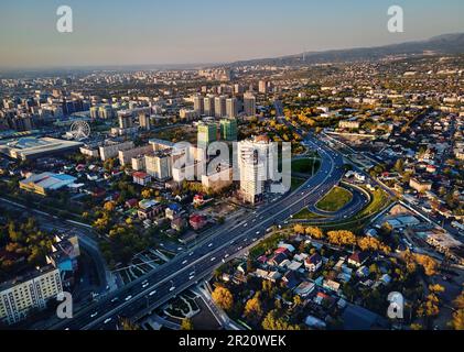 Aerial drone view panorama of Alfarabi avenue with cars traffic and big buildings in Almaty city, Kazakhstan Stock Photo