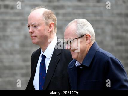 Photograph of Chris Whitty, the UK government's Chief Medical Officer, and Sir Patrick Vallance, Government Chief Scientific Adviser and Head of the Government Science and Engineering, outside Number 10 Downing Street, London ahead of an emergency COBRA meeting as the concern over the coronavirus COVID-19 outbreak grows. Stock Photo