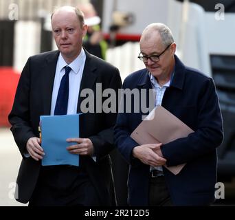 Photograph of Chris Whitty, the UK government's Chief Medical Officer, and Sir Patrick Vallance, Government Chief Scientific Adviser and Head of the Government Science and Engineering, outside Number 10 Downing Street, London ahead of an emergency COBRA meeting as the concern over the coronavirus COVID-19 outbreak grows. Stock Photo