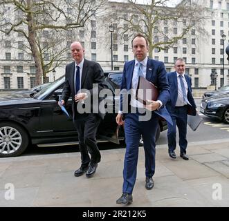 Photograph Matt Hancock, Health Secretary, and Prof. Chris Whitty, the UK government's Chief Medical Officer, arrive outside the Cabinet Office, Whitehall, London ahead of an emergency COBRA meeting as the concern over the coronavirus COVID-19 outbreak grows. Stock Photo