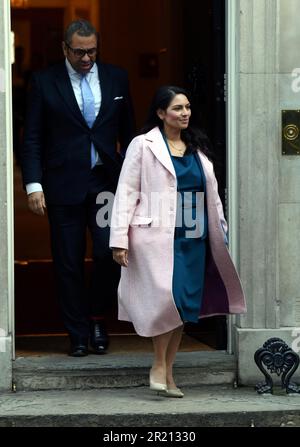 Photograph of Priti Patel, Home Secretary, leaving Number 10 Downing Street, London following a cabinet meeting. Behind her is James Cleverly, Co-Chairman of the Conservative Party. Stock Photo