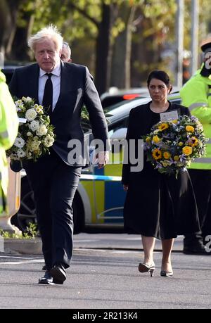 Prime Minister Boris Johnson, and Home Secretary Priti Patel, lay floral tributes near Belfairs Methodist Church in Eastwood Road North, Leigh on Sea, Southend on Sea, Essex after Conservative MP Sir David Amess died having being stabbed multiple times at his constituency surgery. October, 2021. Stock Photo