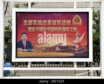 A propaganda poster depicting President Xi Jinping at a military hospital in Kaiyuan, Yunnan, China Stock Photo