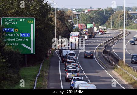 United Kingdom: Queues of traffic on the A12 as police arrest climate change protesters who attempted to block the M25 at junction 28 near Brentwood, Essex as they demand government action on home insulation. Climate change protest Insulate Britain, said action would go on until a 'meaningful commitment' was made Stock Photo