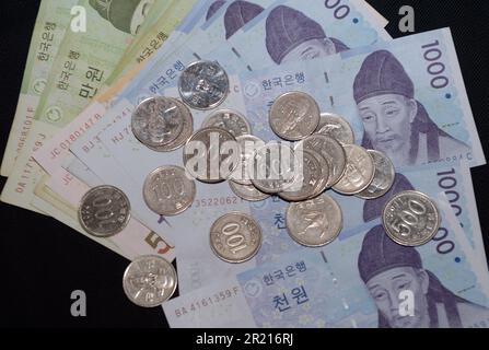 The Korean won. The South Korean won, officially the Korean Republic won is the official currency of South Korea. A single won is divided into 100 jeon, the monetary subunit. The jeon is no longer used for everyday transactions, and it appears only in foreign exchange rates. Stock Photo