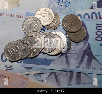 The Korean won. The South Korean won, officially the Korean Republic won is the official currency of South Korea. A single won is divided into 100 jeon, the monetary subunit. The jeon is no longer used for everyday transactions, and it appears only in foreign exchange rates. Stock Photo