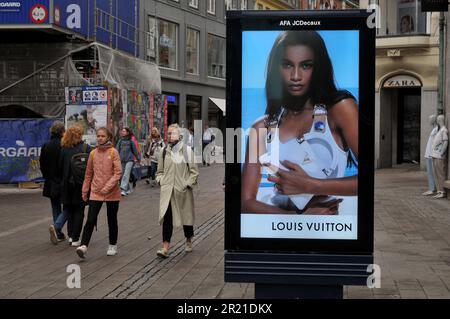 25 May 2023/ Consumers wait at Louis Vuitton store in danish capital  Copenhagen on stroeget pedestrain stree. (Photo.Francis Joseph Dean/Dean  Pictures Stock Photo - Alamy