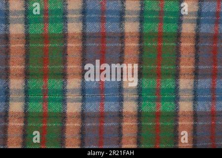 Wool plaid texture. Soft and warm folded alpaca wool blanket. motley wool plaid texture macro shot. Wool coat Stock Photo