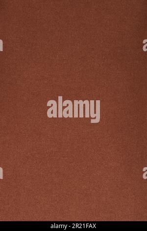 Brown fleece fabric. The texture of the fleece is gray. The background is fleece. Fleece fabric surface. Stock Photo