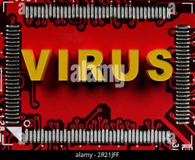 red electronic circuit board with microchip and computer virus text Stock Photo