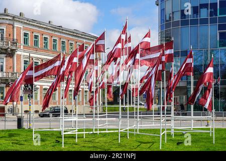 Many national flags of Latvia waving on public holidays in the city square, Liepaja, Latvia Stock Photo