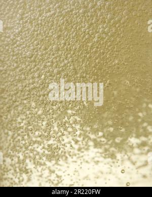 Close up background texture of sparkling wine champagne with bubbles Stock Photo
