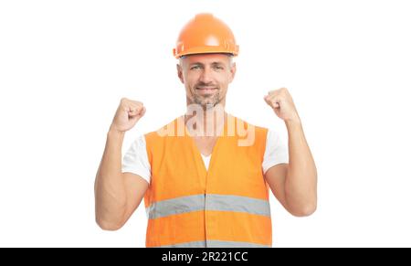 photo of glad man engineer wearing reflective vest. man engineer isolated on white. man engineer in white studio. man engineer on background. Stock Photo