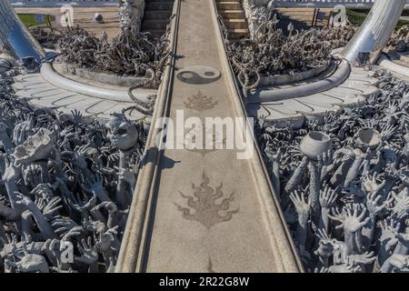 Bridge of 'the cycle of rebirth' at Wat Rong Khun (White Temple) in Chiang Rai province, Thailand Stock Photo