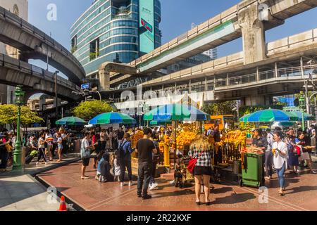 BANGKOK, THAILAND - DECEMBER 14, 2019: View of BTS lines and the Erawan shrine in Bangkok, Thailand Stock Photo