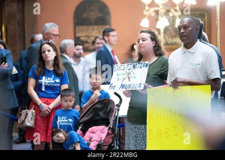 Columbia, United States. 16th May, 2023. Demonstrators gather with placards and signs in the lobby of the South Carolina Statehouse where the Gov. Henry McMaster called the House of Representatives back into session and Tuesday was devoted to debate on an amended version of S. 474, the Senate's 6-week abortion ban bill. Credit: SOPA Images Limited/Alamy Live News Stock Photo