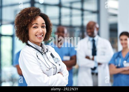 The patient always comes first. Portrait of a young doctor standing in a hospital. Stock Photo