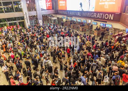 SINGAPORE, SINGAPORE - DECEMBER 17, 2019: Long lines at Singapore Changi Airport immigration check. Stock Photo