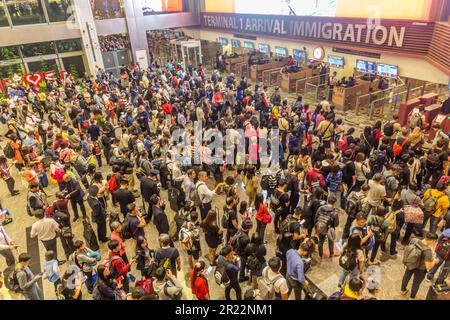 SINGAPORE, SINGAPORE - DECEMBER 17, 2019: Long lines at Singapore Changi Airport immigration check. Stock Photo
