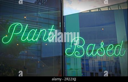 Green neon sign in Vegetarian restaurant, Liverpool - Plant Based Stock Photo