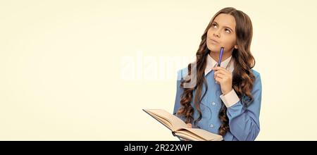 Thinking kid solve mathematical problem holding school book isolated on white. Portrait of schoolgirl student, studio banner header. School child face Stock Photo