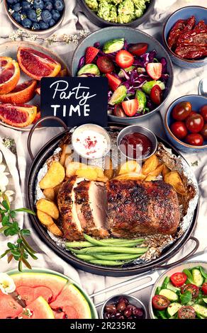 Family dinner or lunch. Many dishes on the table. Top view, Stock Photo