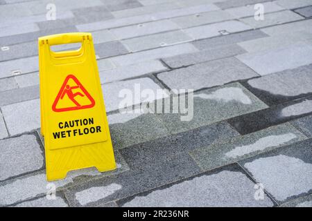 Sign showing warning of caution wet floor Stock Photo